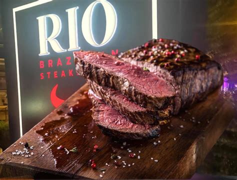 Rio brazilian steakhouse - 3.7 miles away from Rio Brazilian Steakhouse Daniel C. said "A few nights ago I was stranded with a spicy senorita at Burquitlam Station. We were both incredibly hungry and noticed a flickering light from across the street, it was a pizza place, and we were sold.